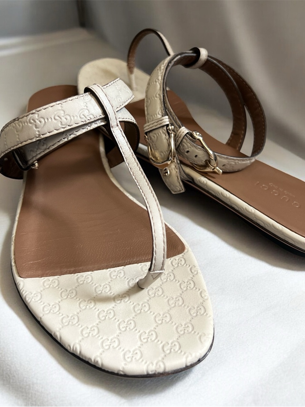 Gucci Cream Leather Embossed T-Strap Sandals with Gold Buckle